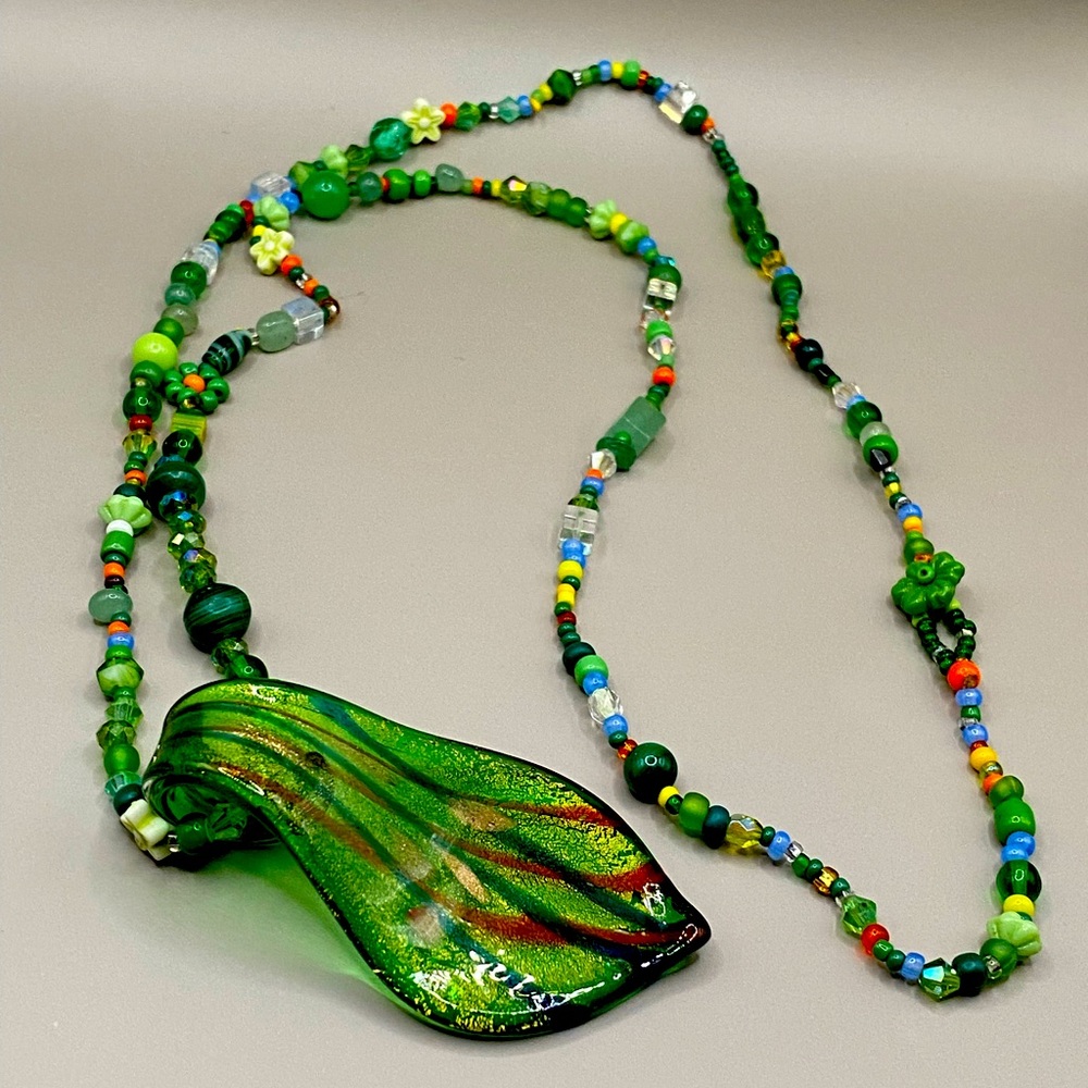 Green glass blown pendant with beaded strand